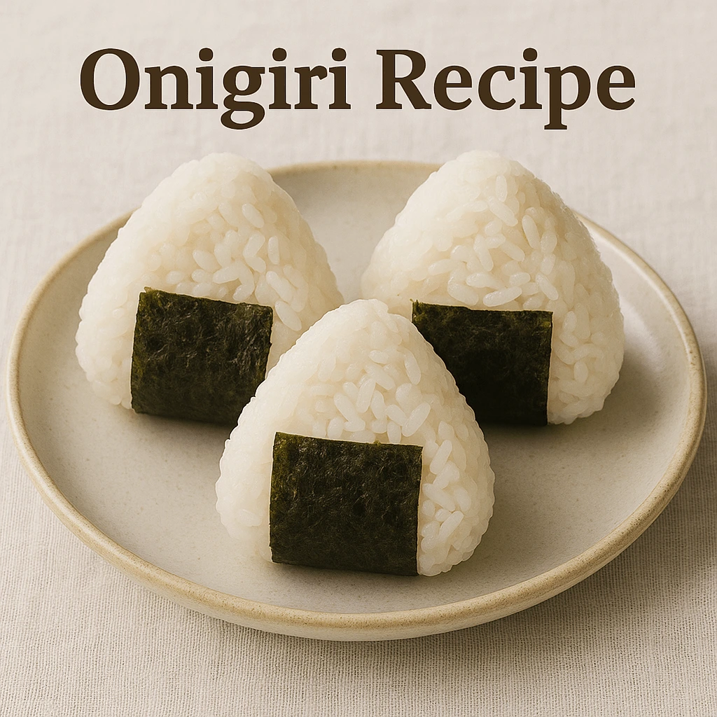 Three triangular onigiri rice balls wrapped with nori on a plate